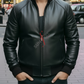 Man wearing a black leather jacket with a red zipper detail, standing on a street.