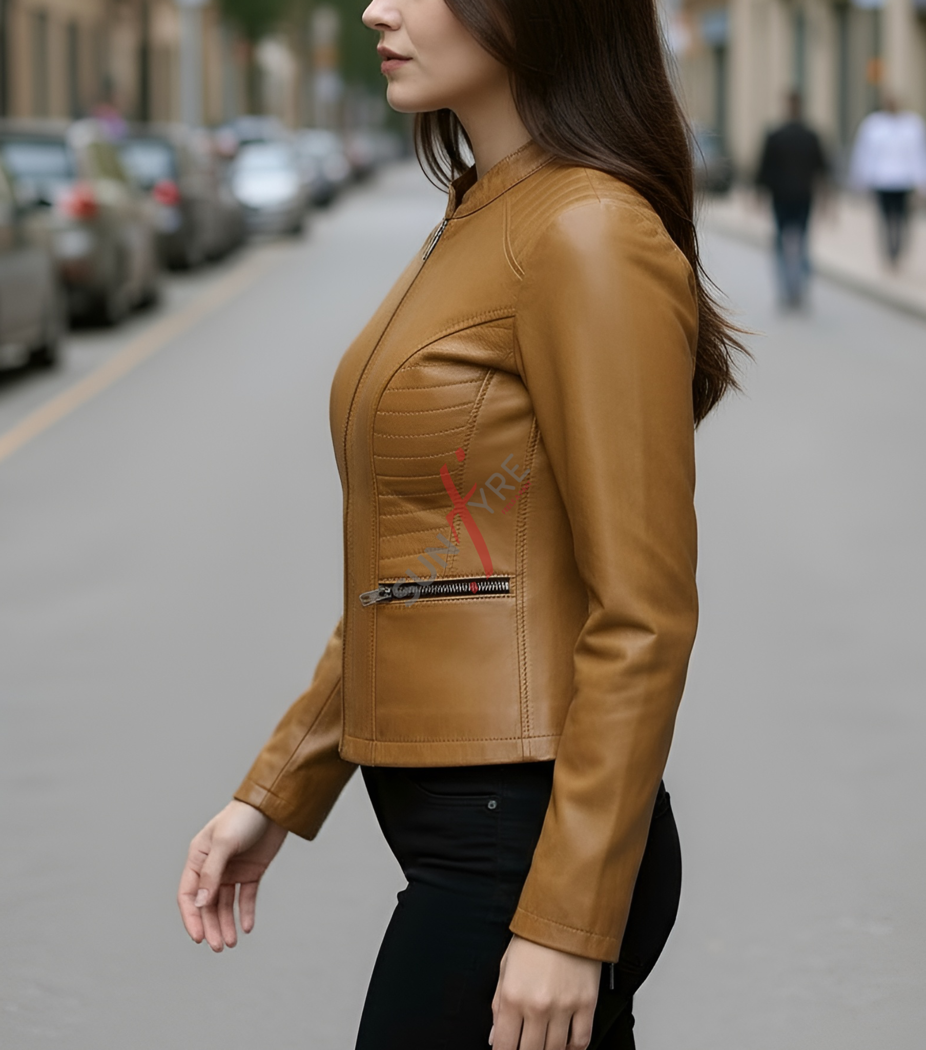 Woman wearing a cognac leather jacket on a city street
