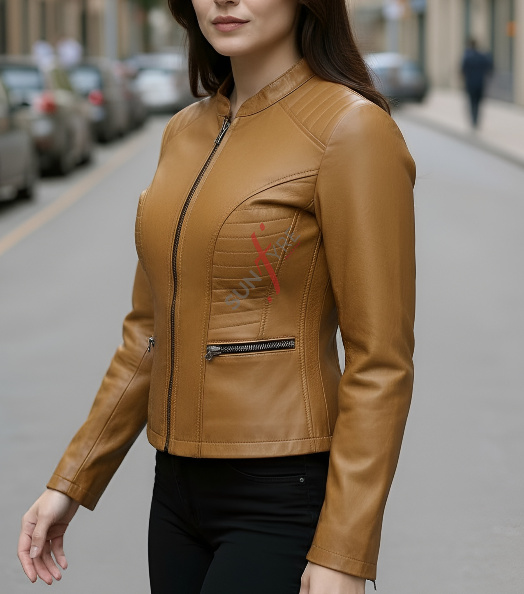 Woman wearing a brown leather jacket on a city street