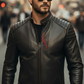 Man wearing a black leather jacket with a blurred city street background