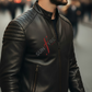 Man wearing a black leather jacket with 'Sunfire' logo in an urban setting