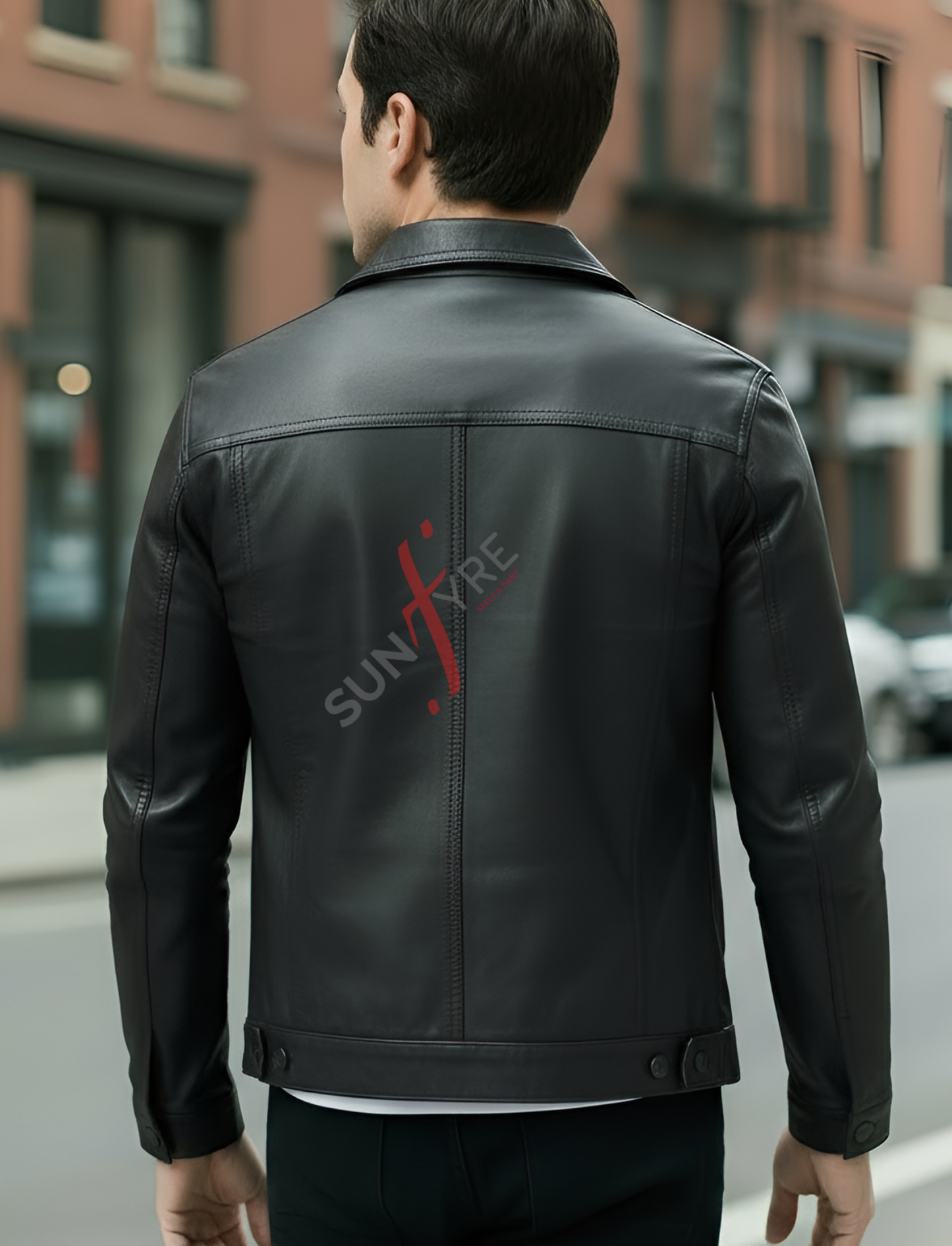 Person wearing a black leather jacket with 'Sunfire' logo on the back, standing on a street.
