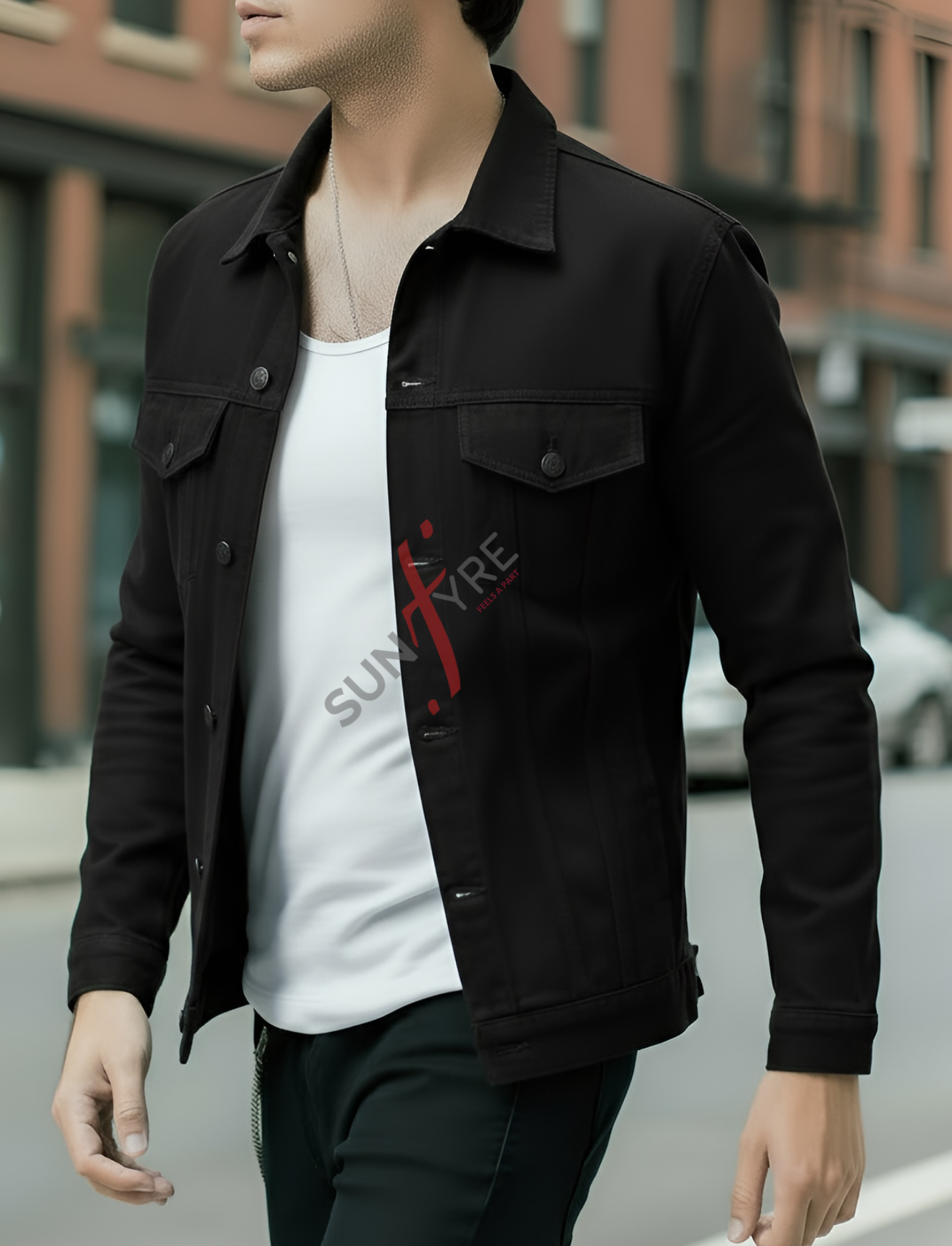 Person wearing a black jacket with a visible brand logo on a blurred street background