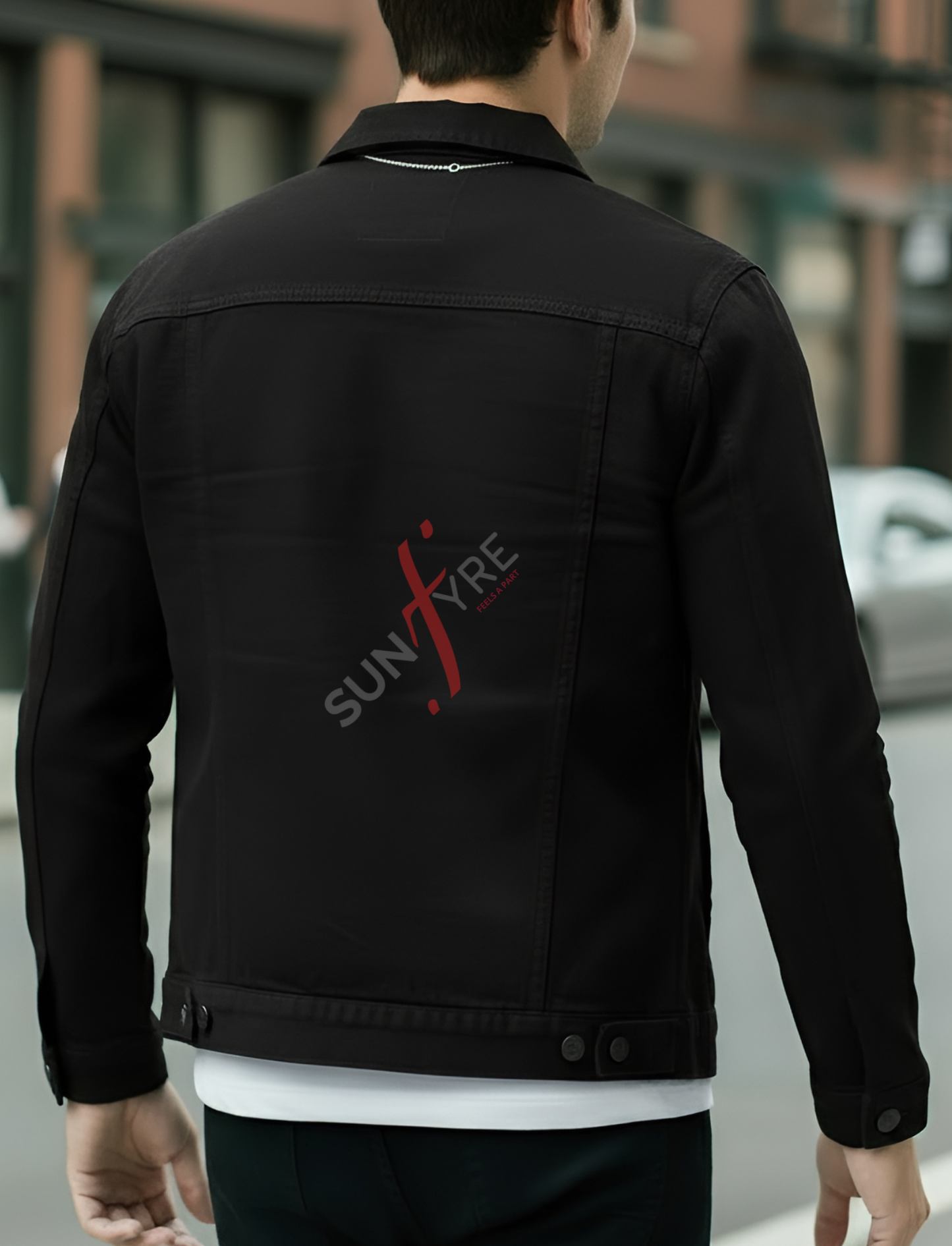 Person wearing a black jacket with 'SUNFYRE' logo on the back, standing outdoors.