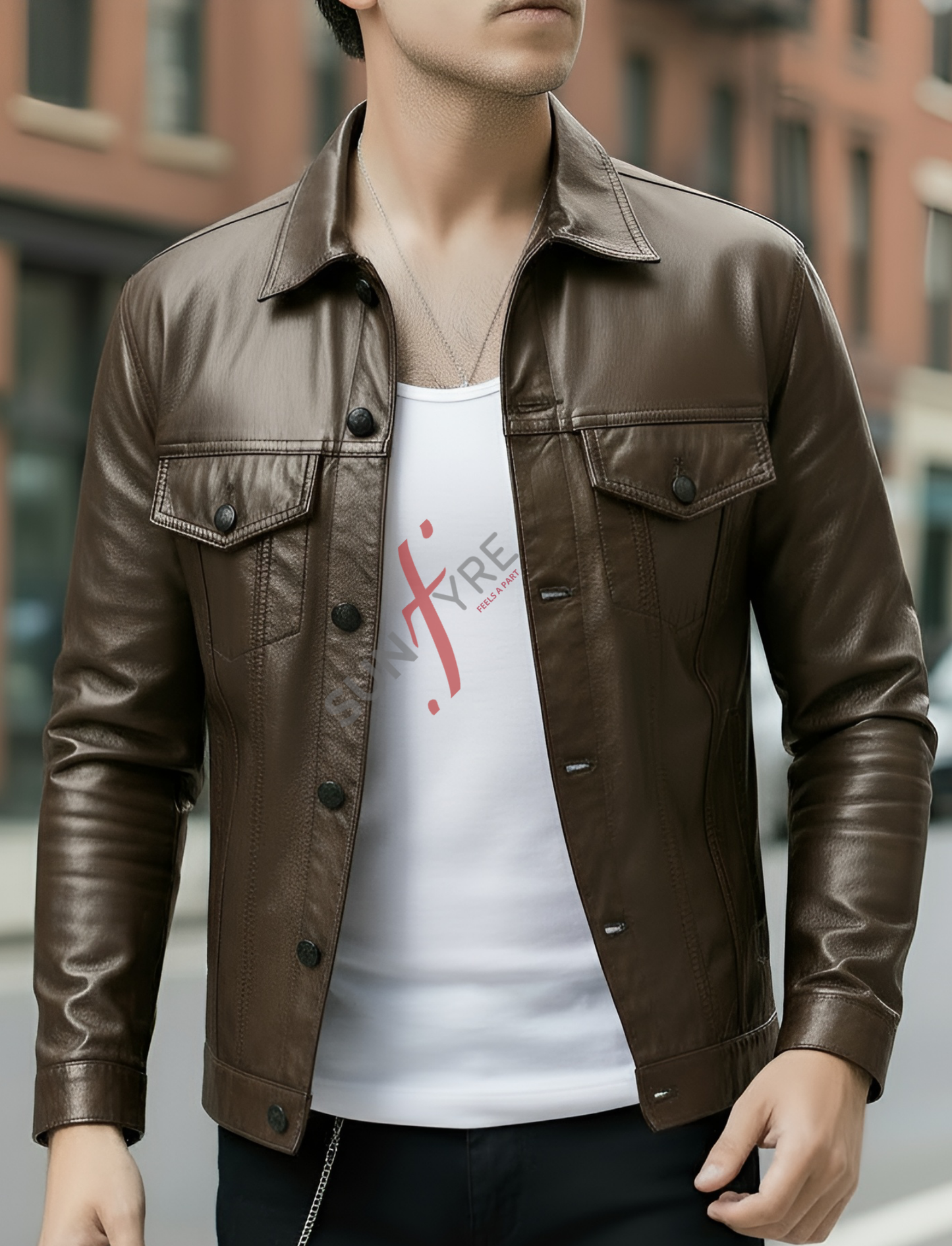 Person wearing a brown leather jacket over a white t-shirt with red graphics, standing in an urban setting.