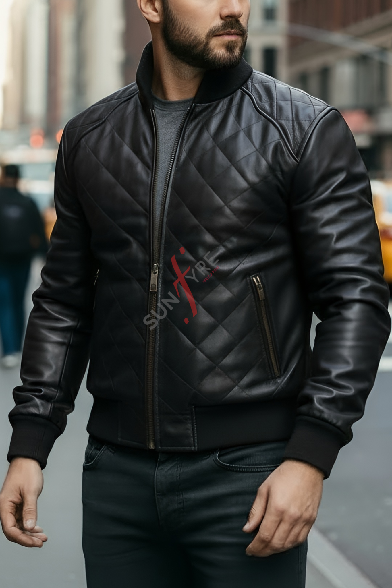 Man wearing a black quilted leather jacket with a brand logo in an urban setting