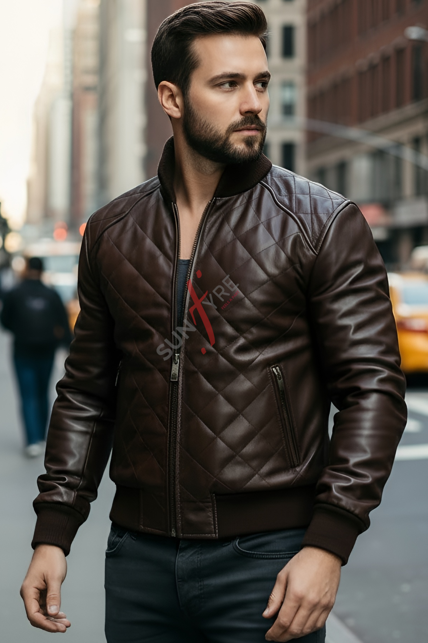 Man wearing a brown leather jacket with a brand logo in an urban setting