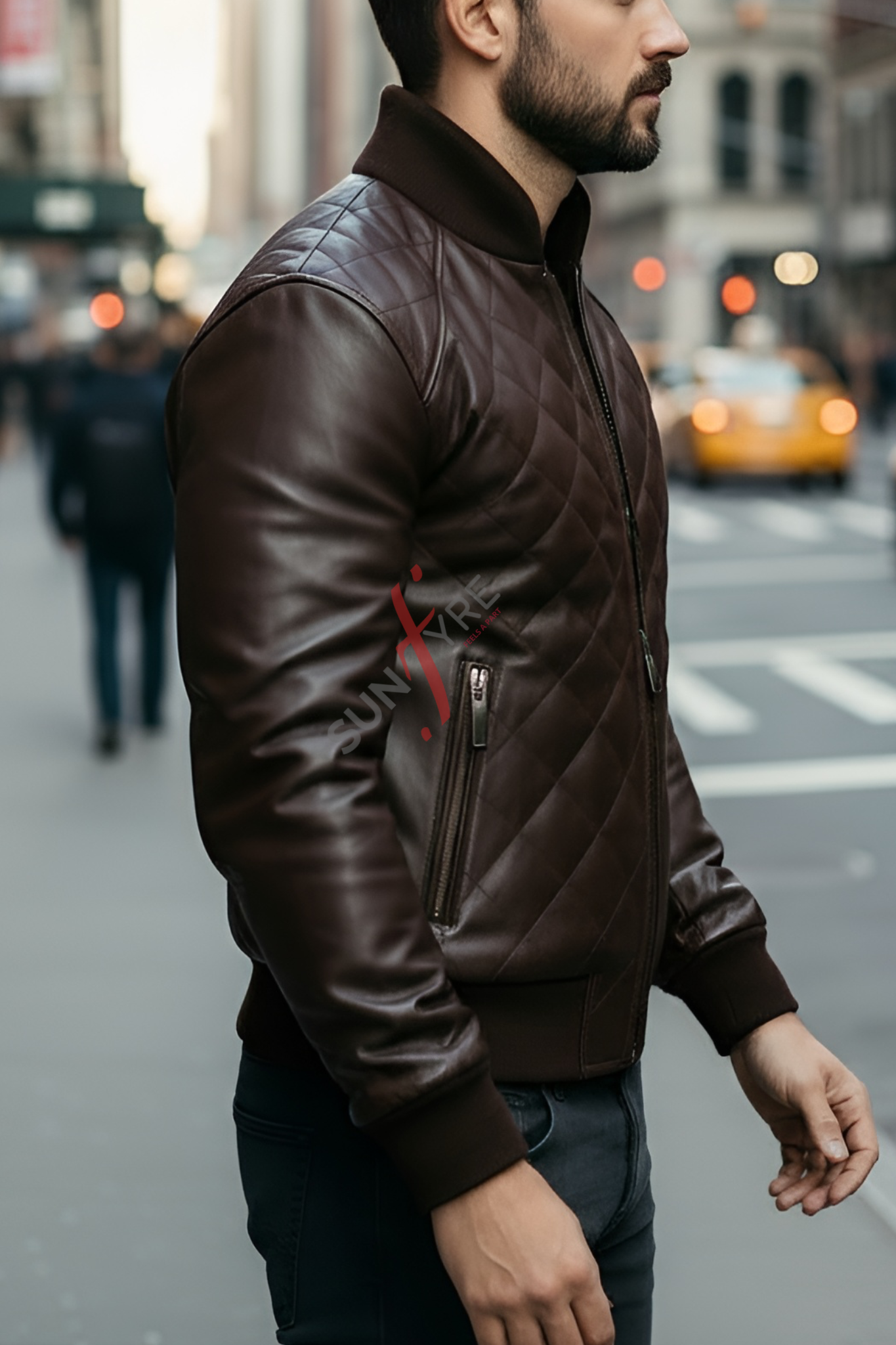 Man wearing a brown leather jacket on a city street