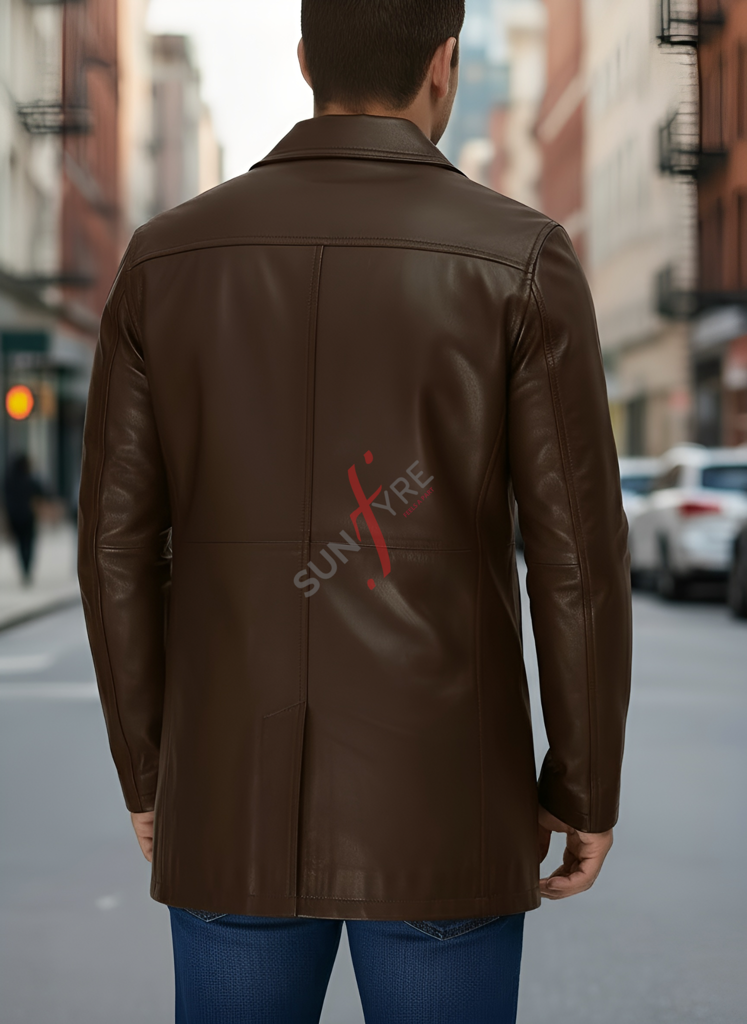 Man wearing a brown leather jacket with 'SUN' logo on a city street