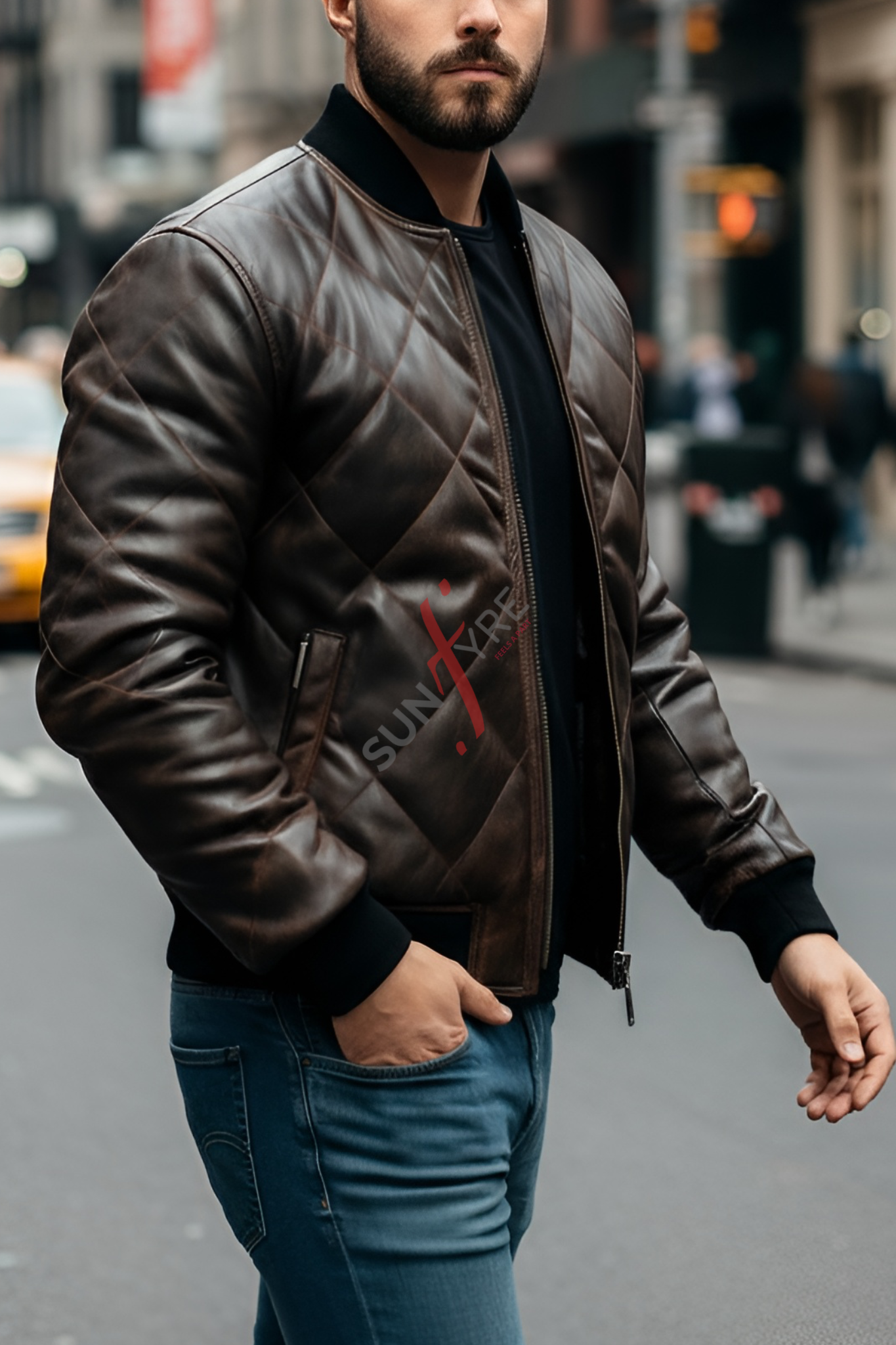 Man wearing a brown leather jacket with a brand logo on a city street
