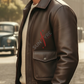 Man wearing a brown leather jacket with 'Sunraye' logo in an urban setting