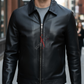 Man wearing a black leather jacket on a city street