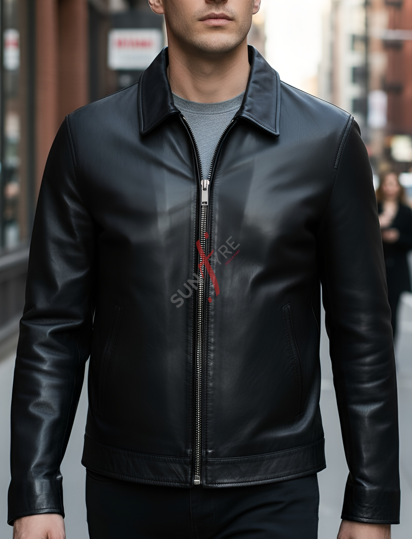 Man wearing a black leather jacket on a city street